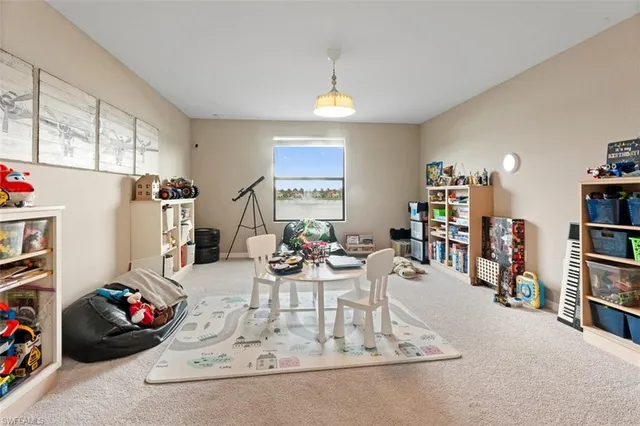 a view of a livingroom with furniture and toys