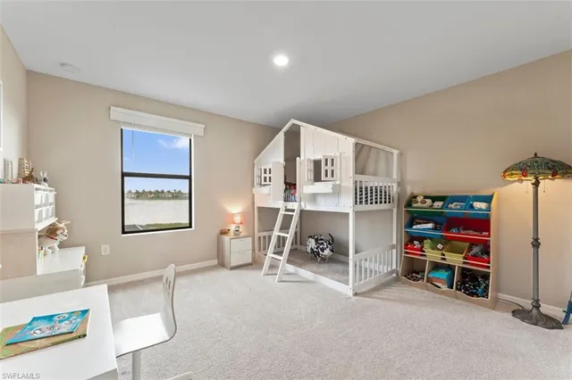 a bedroom with furniture and a book shelf
