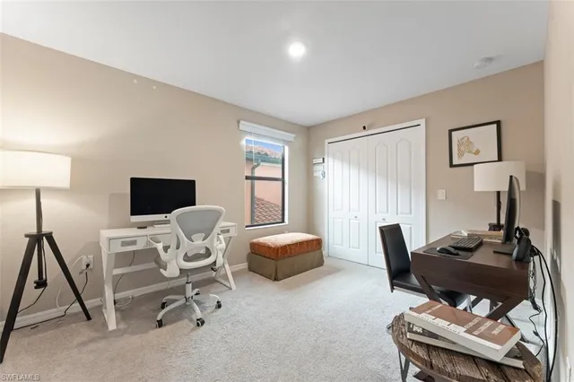 a work room with furniture and a window