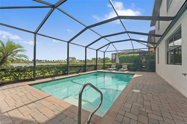 a view of a swimming pool with a porch