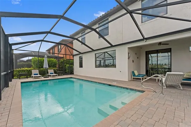 a view of a swimming pool with a patio