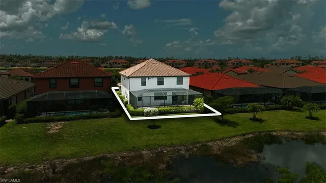 an aerial view of house with a yard