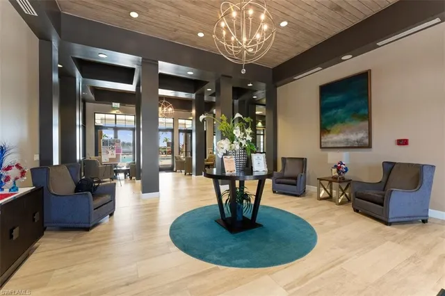 a view of a house with a yard and potted plants