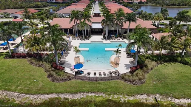 a view of backyard of a house with garden and patio