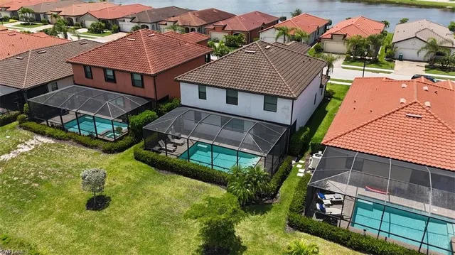 an aerial view of houses with yard