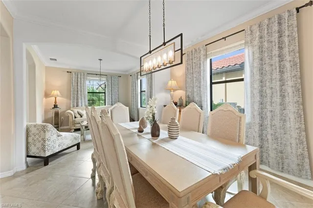 a dining room with furniture and wooden floor