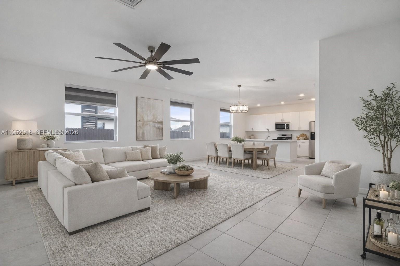 16925 Southwest 289th Terrace Homestead, FL 33033 - Photo 29 of 58 a living room with furniture and a large window