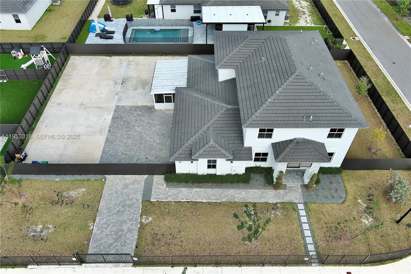 16925 Southwest 289th Terrace Homestead, FL 33033 - Photo 36 of 58 an aerial view of a house with swimming pool