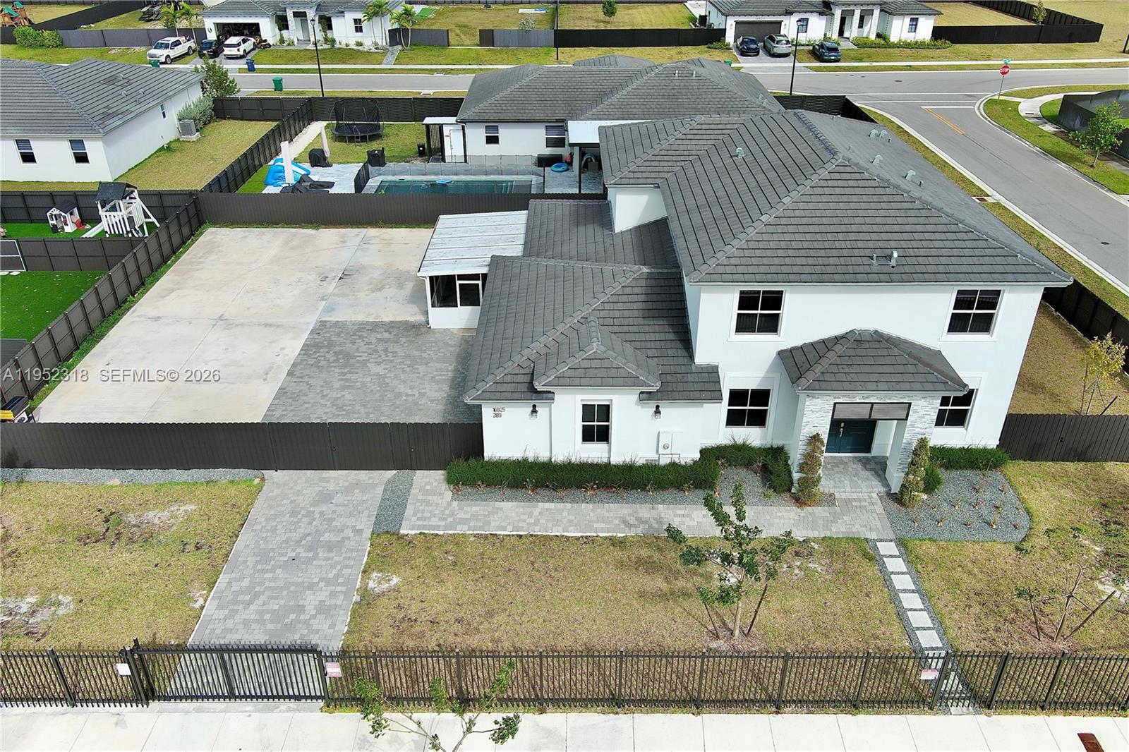 16925 Southwest 289th Terrace Homestead, FL 33033 - Photo 39 of 58 an aerial view of a house with swimming pool