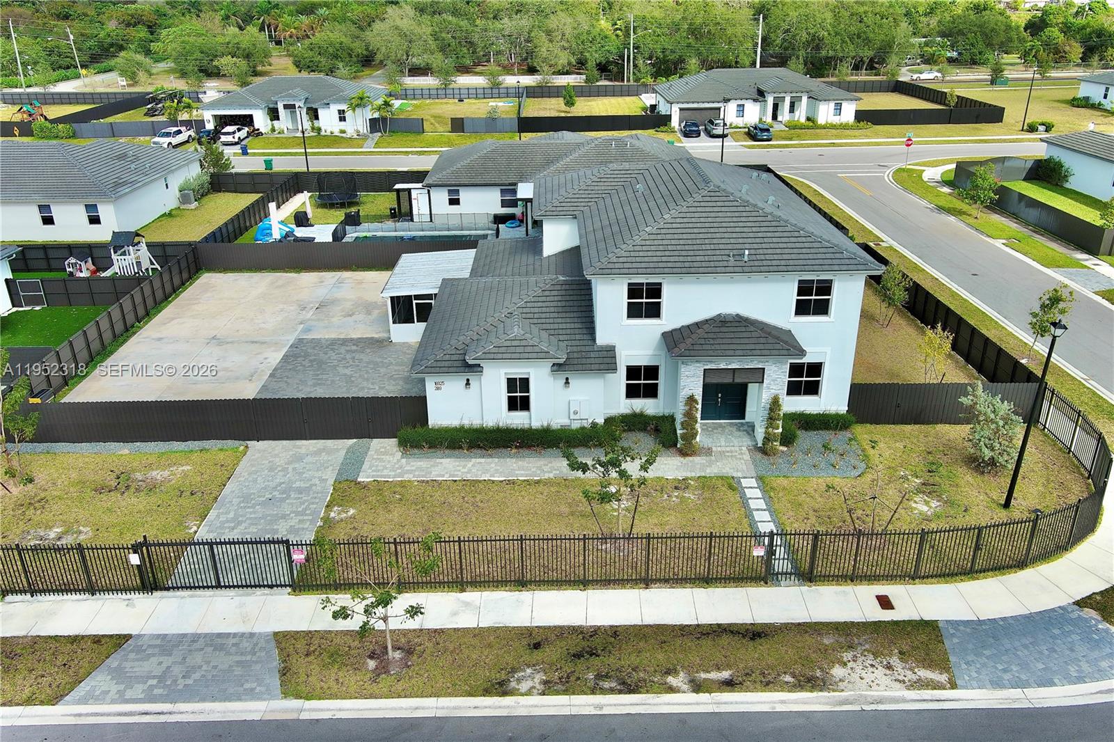 16925 Southwest 289th Terrace Homestead, FL 33033 - Photo 44 of 58 a aerial view of a house with a swimming pool
