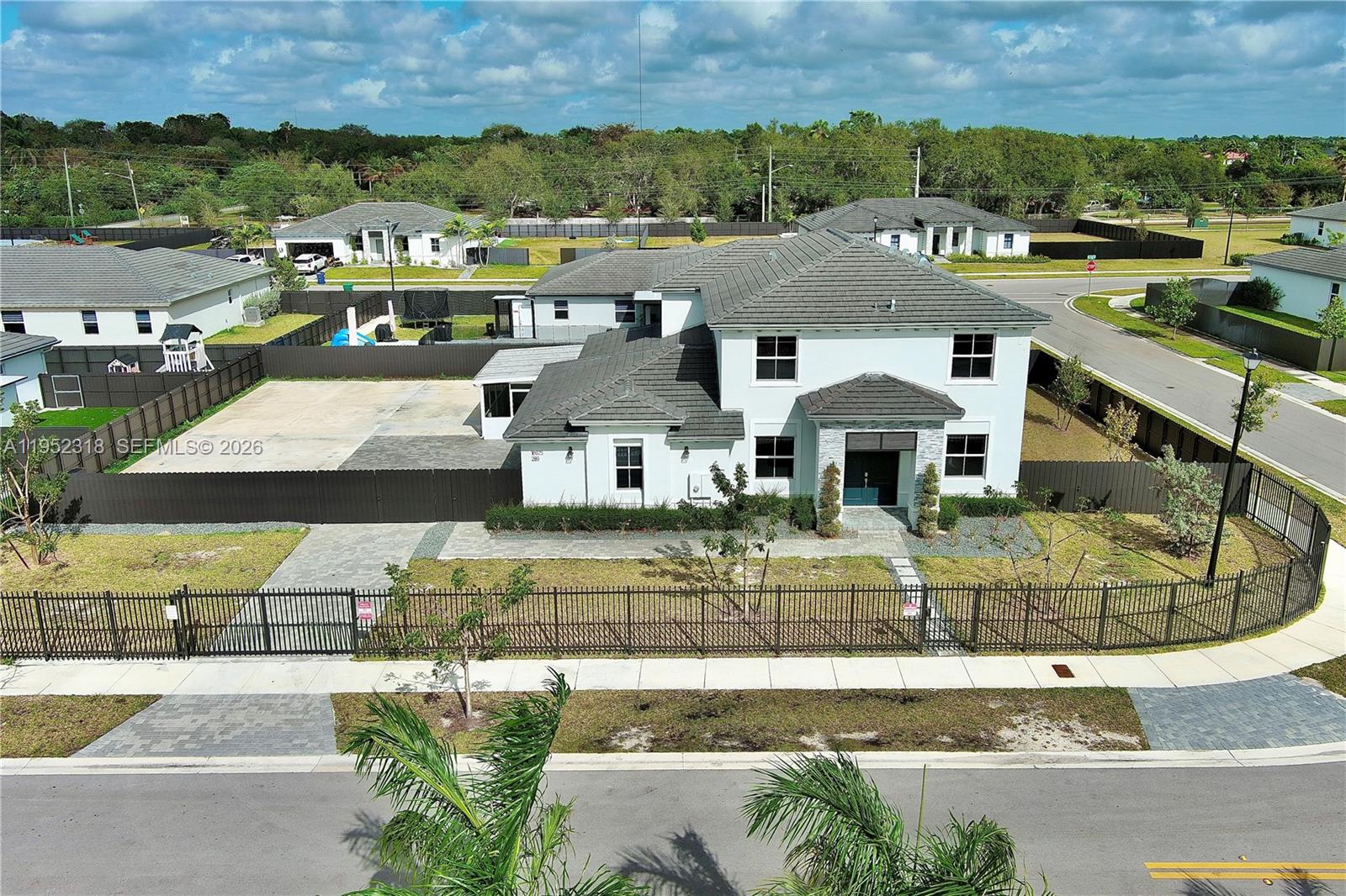 16925 Southwest 289th Terrace Homestead, FL 33033 - Photo 50 of 58 an aerial view of residential houses with outdoor space and parking