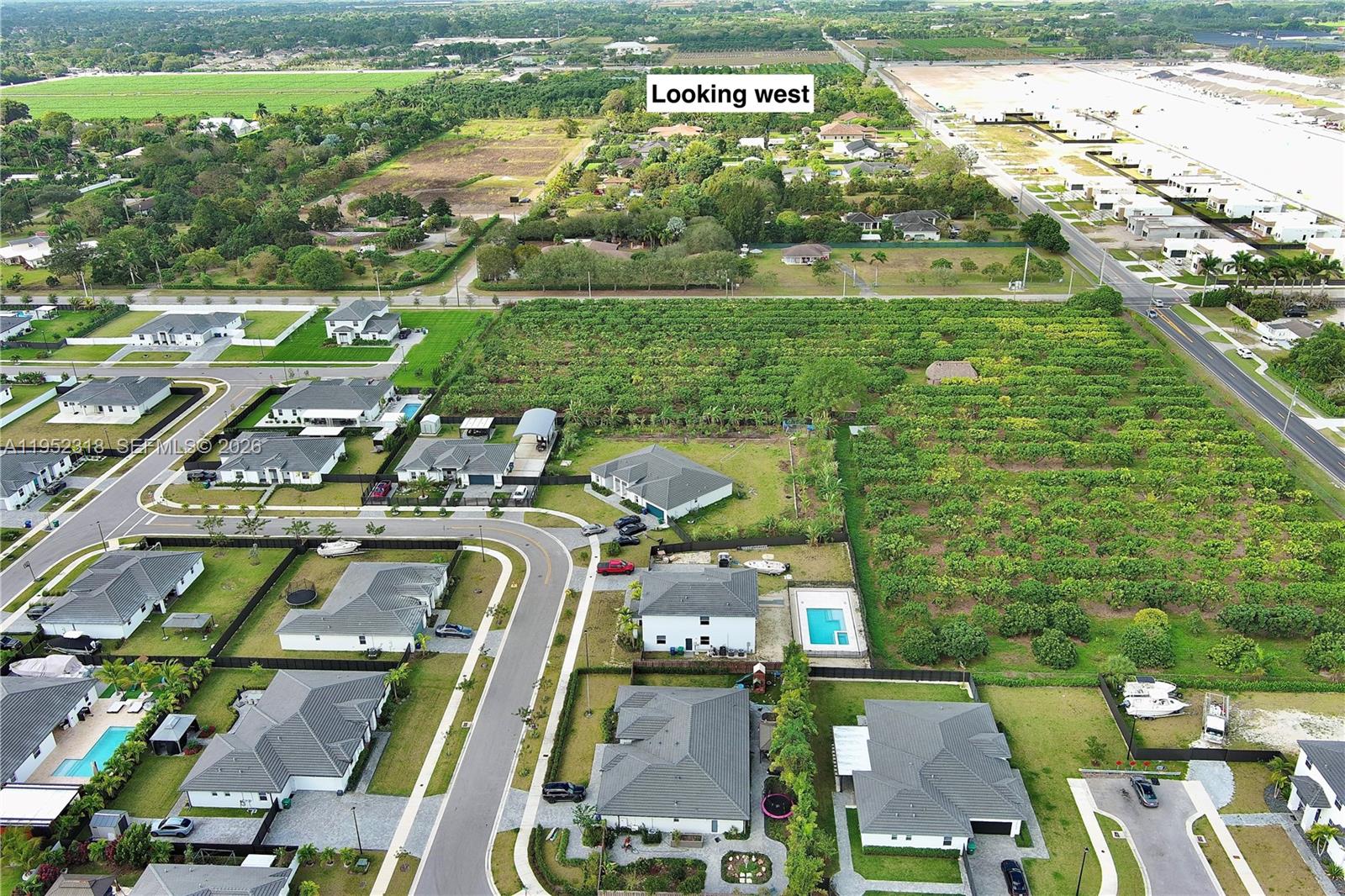 16925 Southwest 289th Terrace Homestead, FL 33033 - Photo 53 of 58 an aerial view of residential houses with outdoor space and swimming pool