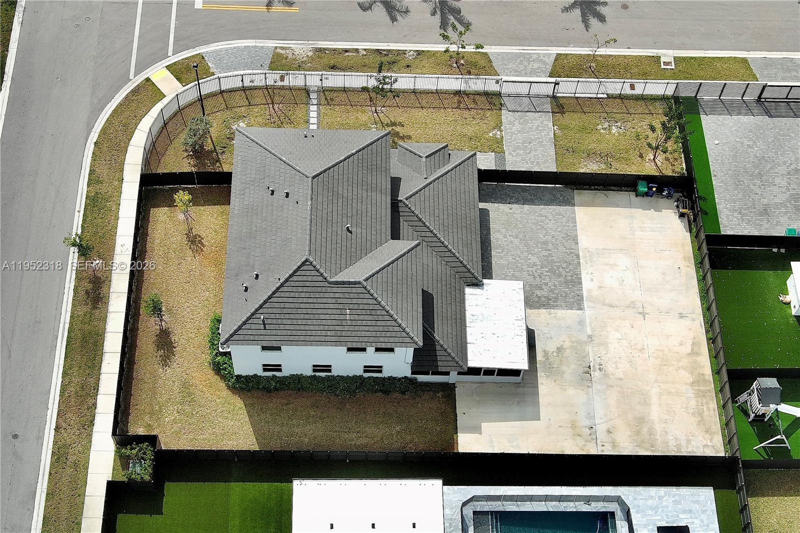 16925 Southwest 289th Terrace Homestead, FL 33033 - Photo 56 of 58 an aerial view of residential houses with outdoor space