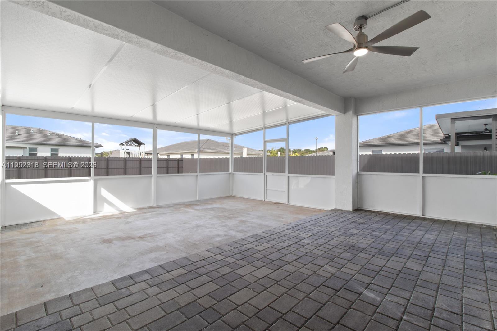 16925 Southwest 289th Terrace Homestead, FL 33033 - Photo 6 of 58 a view of an empty room with a window