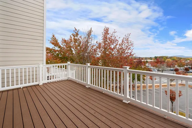 a view of a balcony with wooden floor