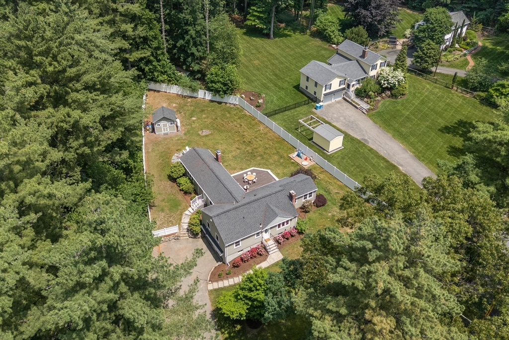 57 Marlboro Road Sudbury, MA 01776 - Photo 38 of 40 an aerial view of a house with a yard and trees