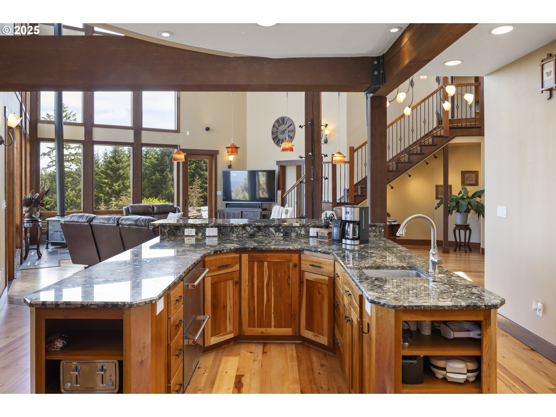 21250 Southwest Jaquith Road Newberg, OR 97132 - Photo 14 of 48 a kitchen with a sink a kitchen island a stove and a wooden cabinets
