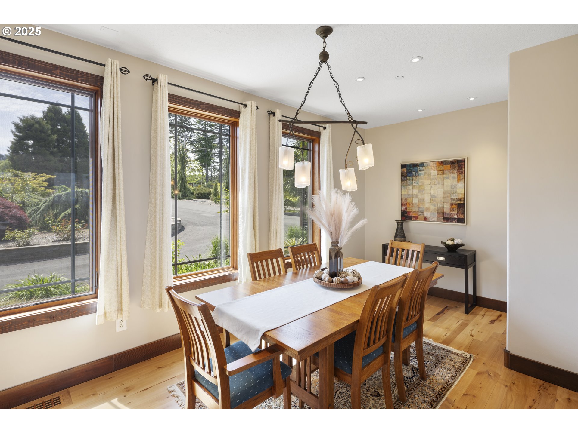 21250 Southwest Jaquith Road Newberg, OR 97132 - Photo 16 of 48 a dining room with furniture a chandelier and wooden floor