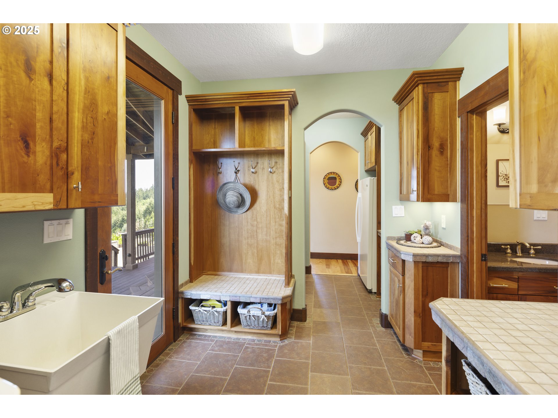 21250 Southwest Jaquith Road Newberg, OR 97132 - Photo 25 of 48 a living room with stainless steel appliances kitchen island granite countertop furniture and a fireplace