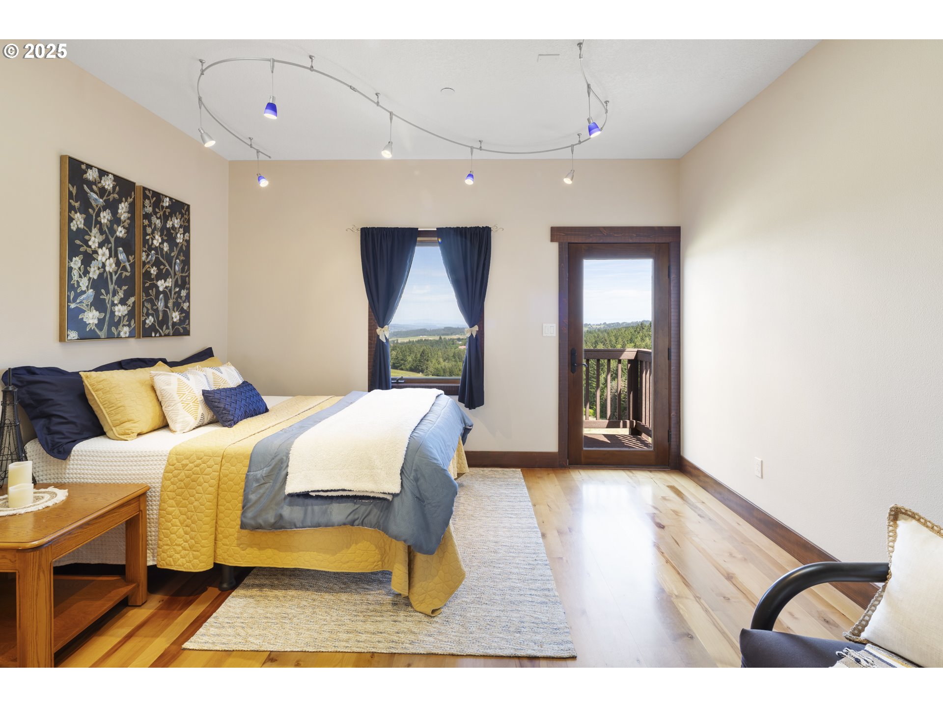 21250 Southwest Jaquith Road Newberg, OR 97132 - Photo 29 of 48 a bedroom with a bed and a large window