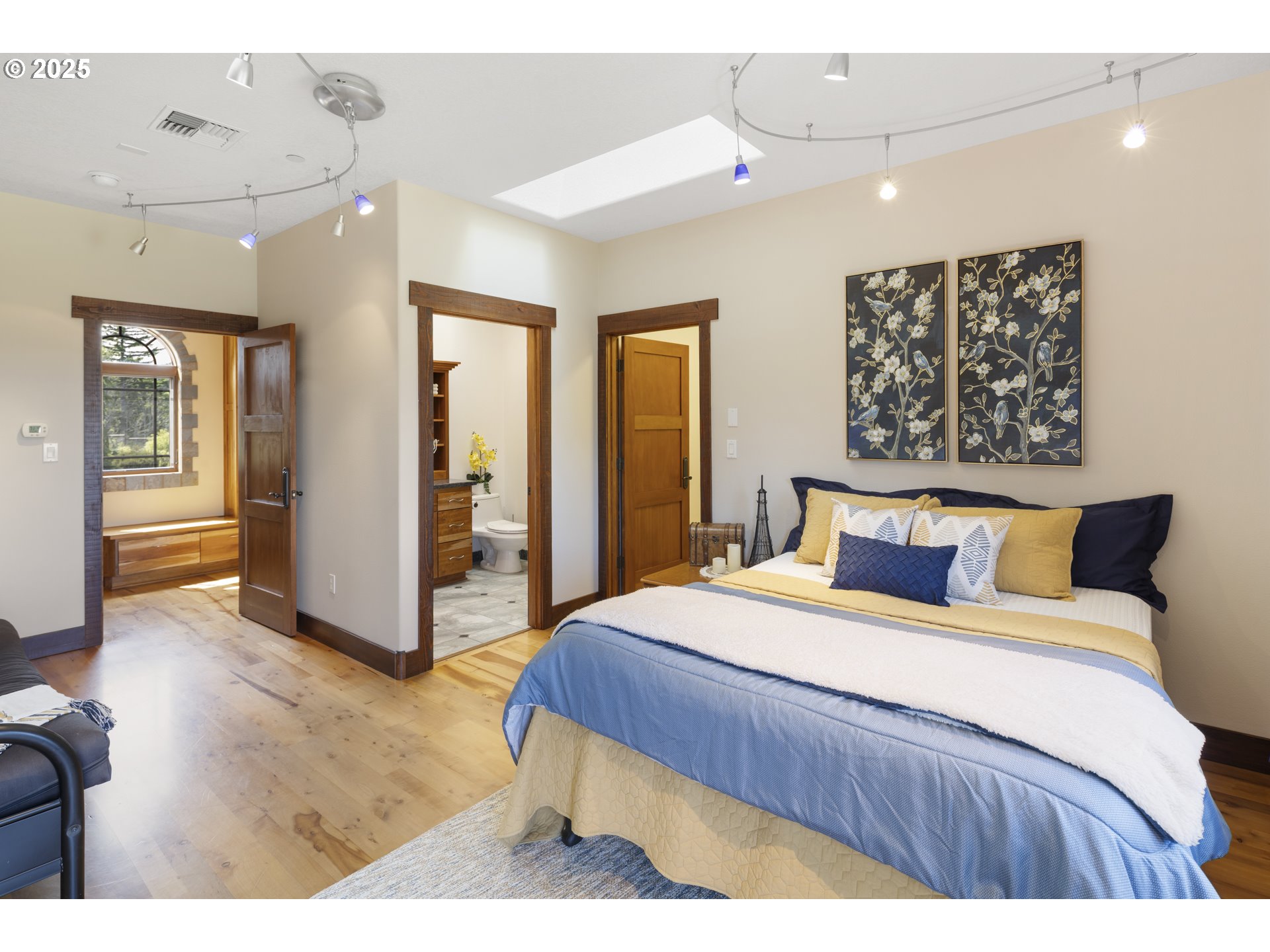 21250 Southwest Jaquith Road Newberg, OR 97132 - Photo 30 of 48 a bedroom with a large bed and a chandelier