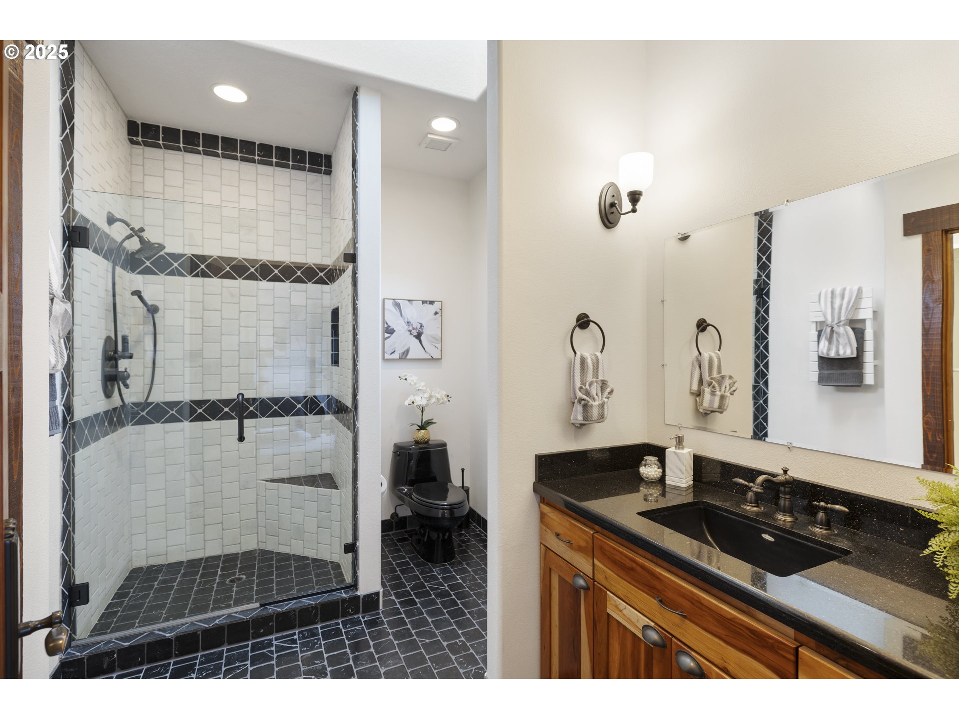 21250 Southwest Jaquith Road Newberg, OR 97132 - Photo 35 of 48 a bathroom with a granite countertop sink a mirror and shower