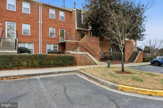 a view of a house with snow on the road