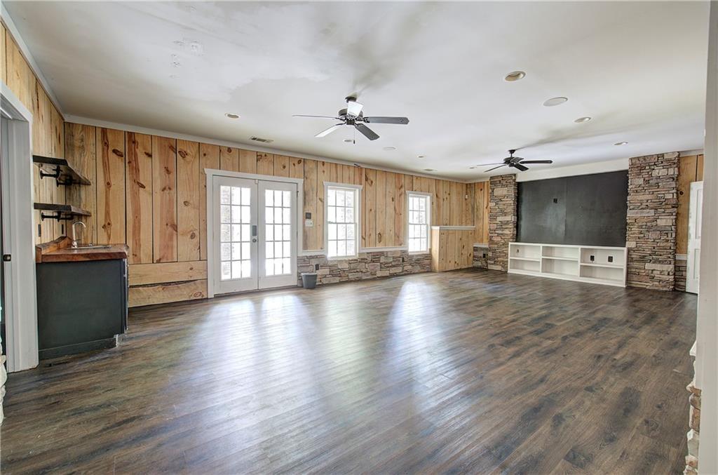 561 Holland Road Dallas, GA 30157 - Photo 30 of 48 an empty room with wooden floor and windows