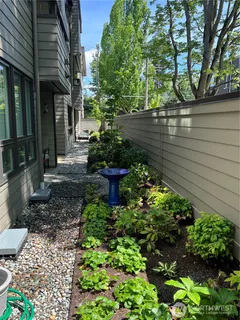 a view of a back yard of the house and a garden