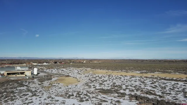 a view of a city street with a beach