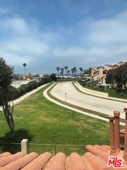 4510 Antigua Way Oxnard, CA 93035 - Photo 2 of 12 a view of a lake with a yard