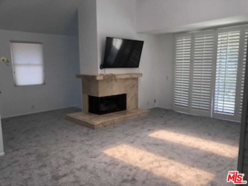4510 Antigua Way Oxnard, CA 93035 - Photo 8 of 12 a view of a livingroom with furniture and a flat screen tv