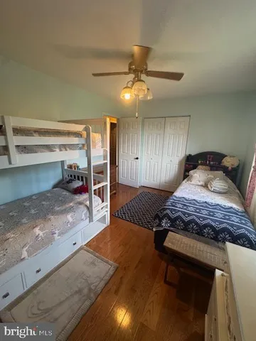 a bedroom with furniture and a chandelier