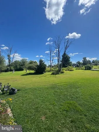 a view of a golf course with a lake