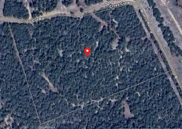 a view of a lake with houses in the back