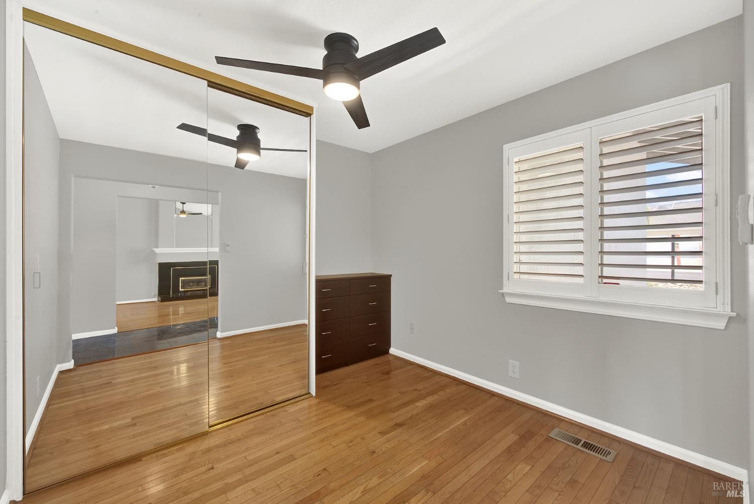 1270 Willow Lake Road Discovery Bay, CA 94505 - Photo 16 of 29 a view of empty room with wooden floor and fan