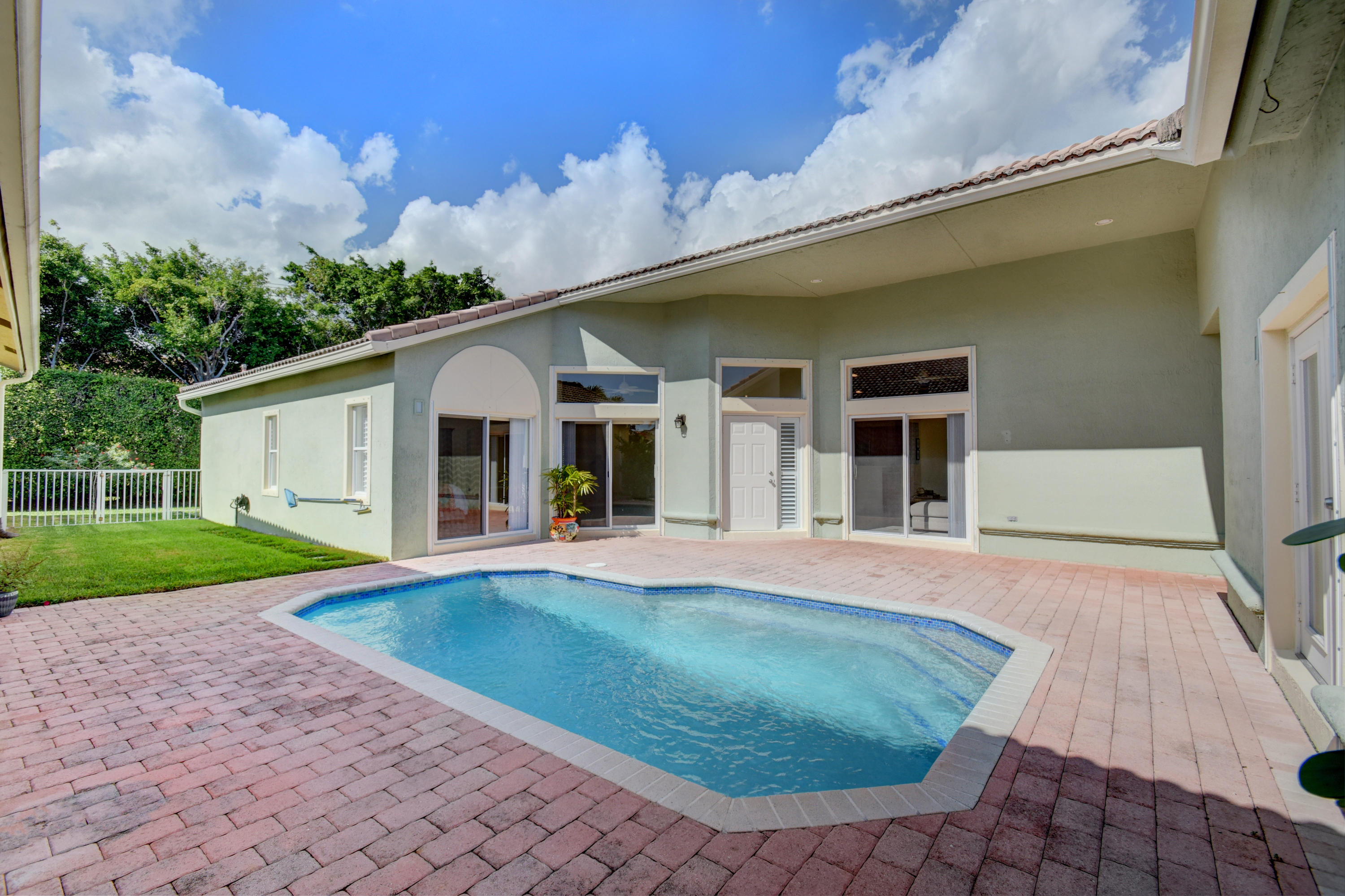 7201 Northwest Turtle Walk Boca Raton, FL 33487 - Photo 27 of 39 Generous patio area around pool