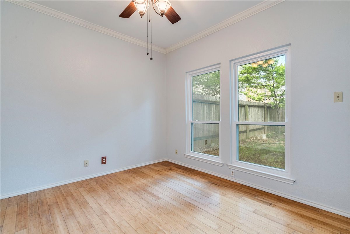 3809 Spicewood Springs Road, Unit 127 Austin, TX 78759 - Photo 20 of 29 Bright hardwood floors and twin windows define this versatile room, ready for your personal touch.