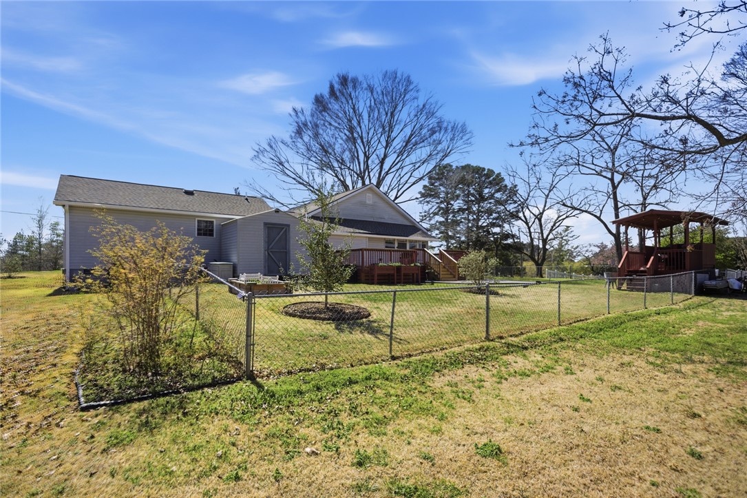 175 Burkett Road Seneca, SC 29672 - Photo 47 of 47 This expansive backyard offers a vibrant outdoor living space for relaxation and enjoyment.