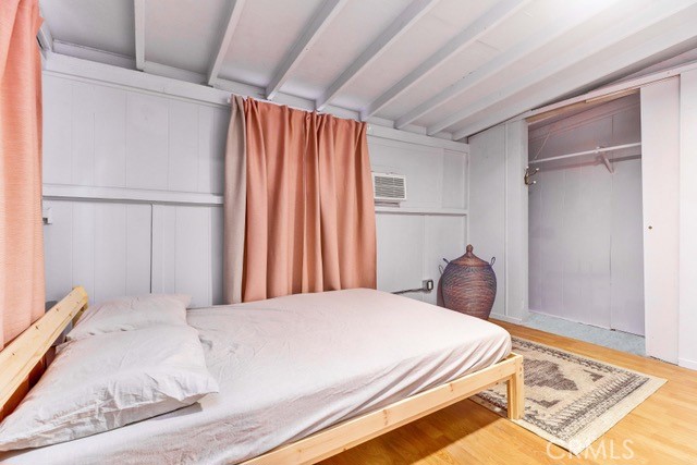 7553 McGroarty Street Tujunga, CA 91042 - Photo 12 of 38 a bedroom with a bed and a cabinets