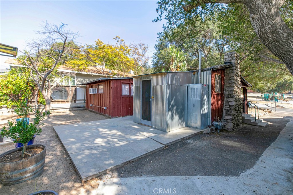 7553 McGroarty Street Tujunga, CA 91042 - Photo 17 of 38 a view of a house with a backyard and basketball area