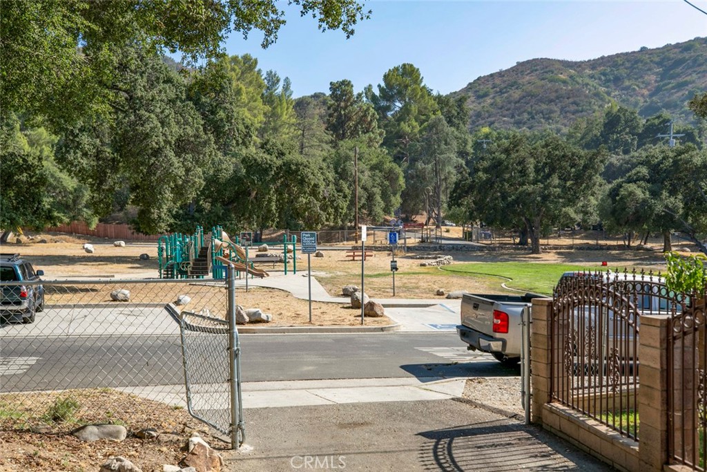 7553 McGroarty Street Tujunga, CA 91042 - Photo 29 of 38 a view of a swimming pool with a patio and a fire pit