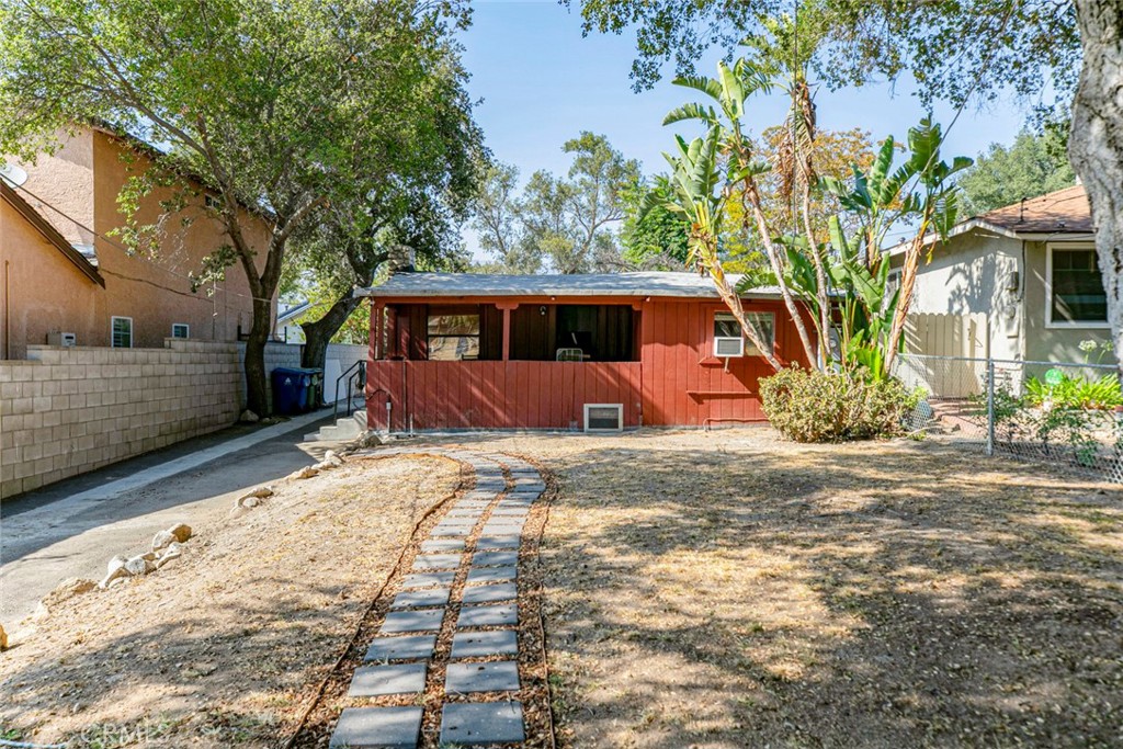 7553 McGroarty Street Tujunga, CA 91042 - Photo 31 of 38 a front view of a house with garden