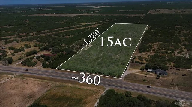 an aerial view of a house with yard