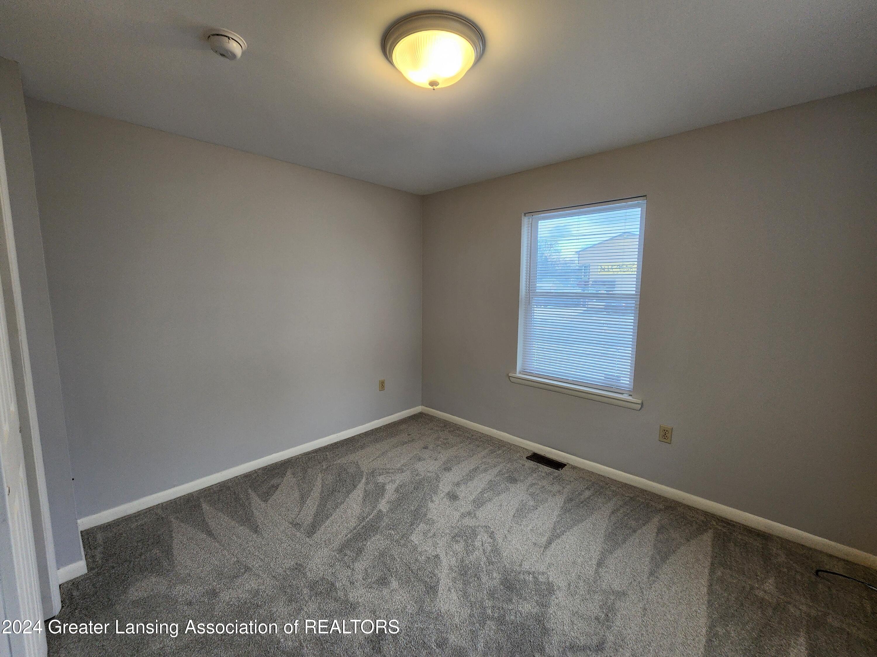 2801 Turner Road Lansing, MI 48906 - Photo 12 of 18 1st floor bedroom