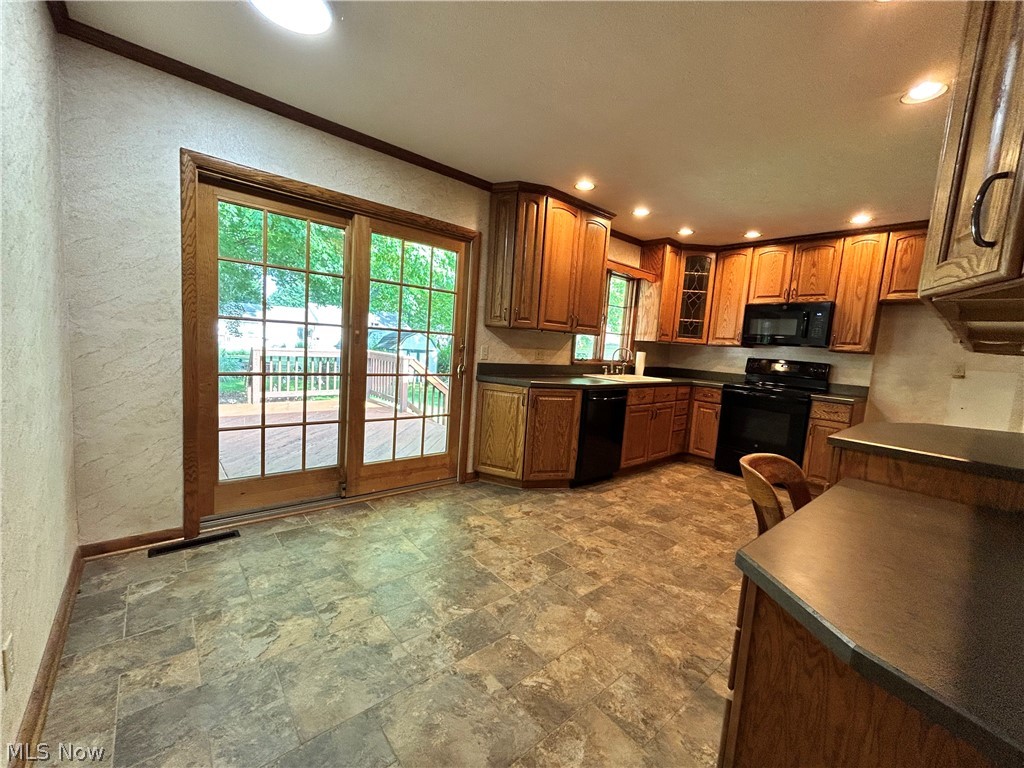 443 Lansing Road Akron, OH 44312 - Photo 9 of 29 Dining area with slider door leading out to Deck and backyard