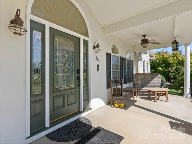 a view of a lobby with chair and front door