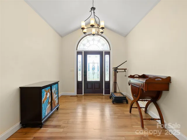 a view of an entryway with wooden floor
