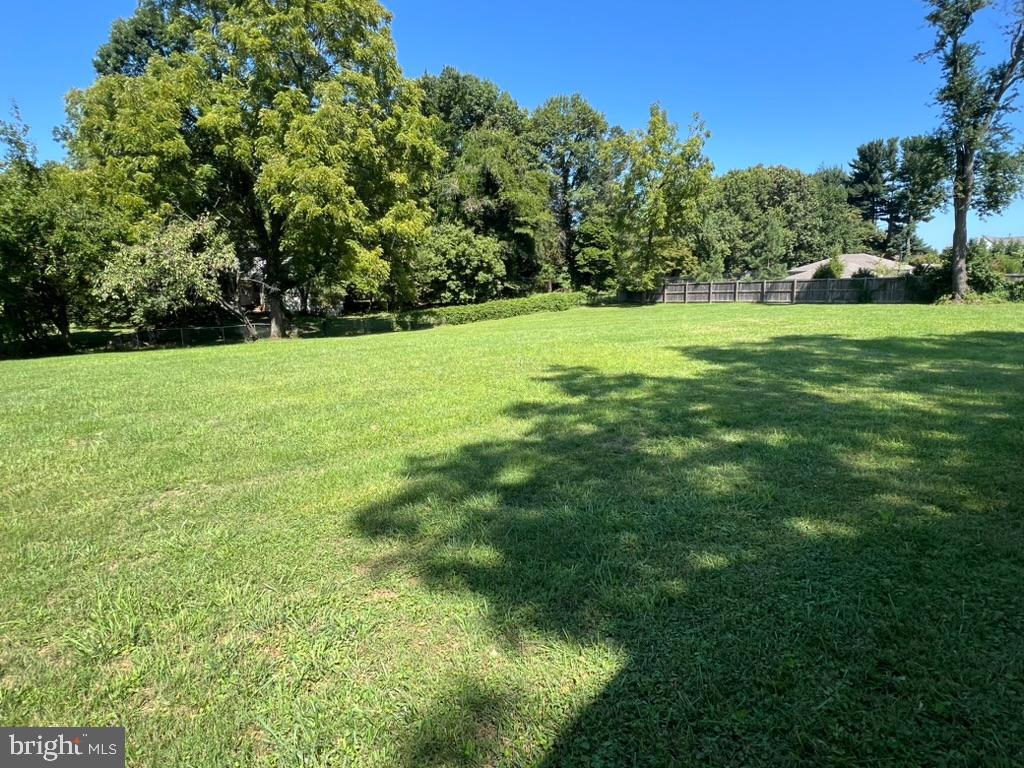 13719 Notley Road Silver Spring, MD 20904 - Photo 2 of 8 a view of green field with trees in the background