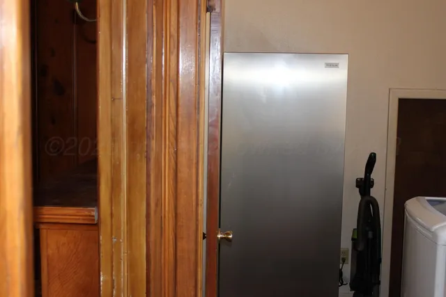 a view of a door with wooden floor